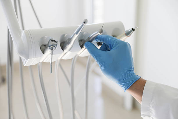 Professional Tooth Extraction technician working in Mason, MI